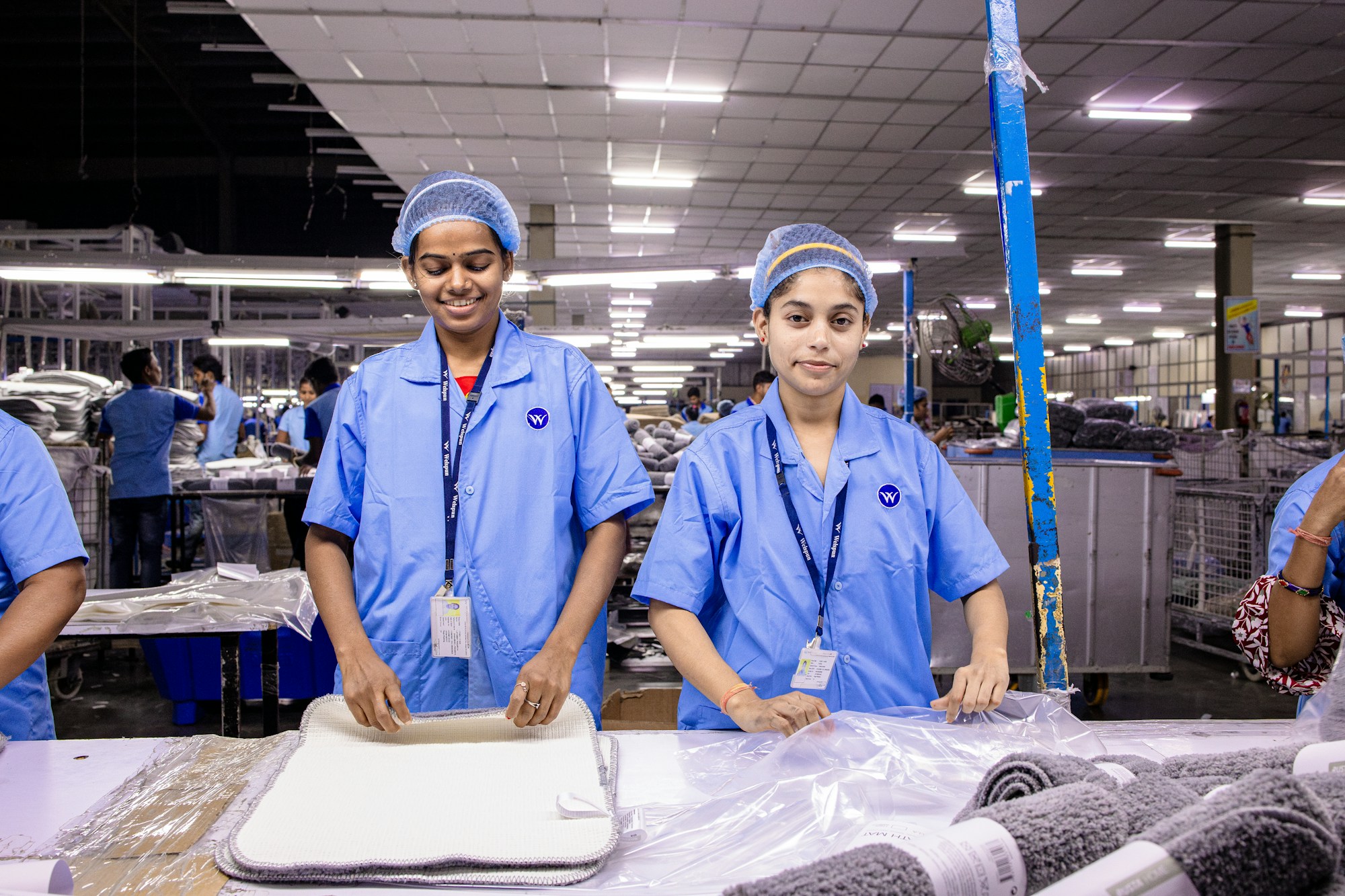 A manufacturing team collaborating on a factory floor